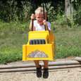 Front view of the toddler swing with young boy riding in the bucket.