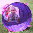 Little girl crawling through the play tunnel.